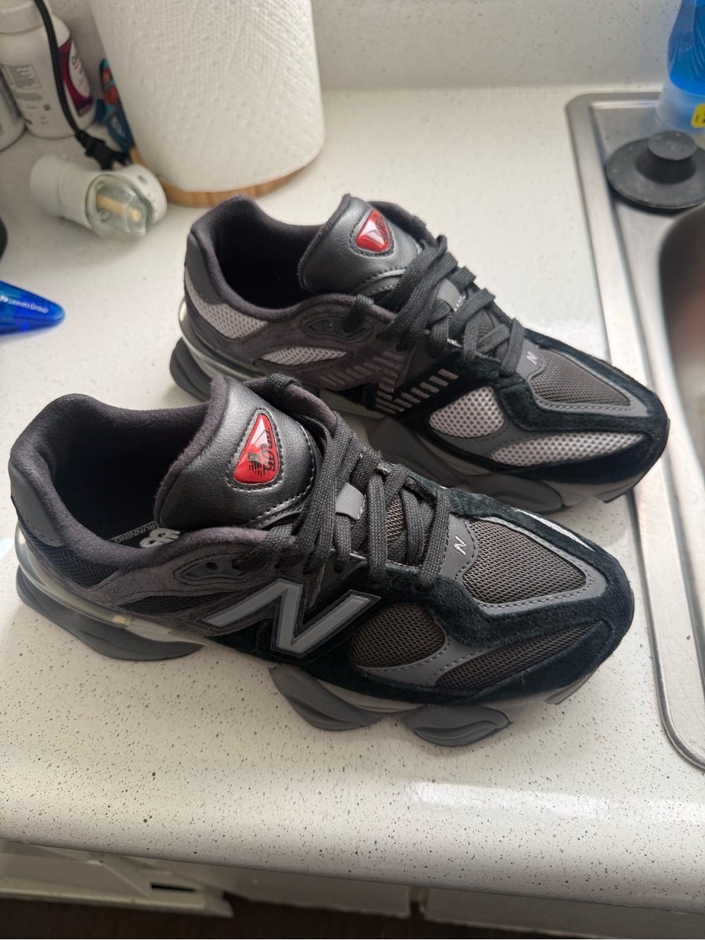 New Balance Men’s Black and Gray Athletic Sneakers with Red Logo Accent